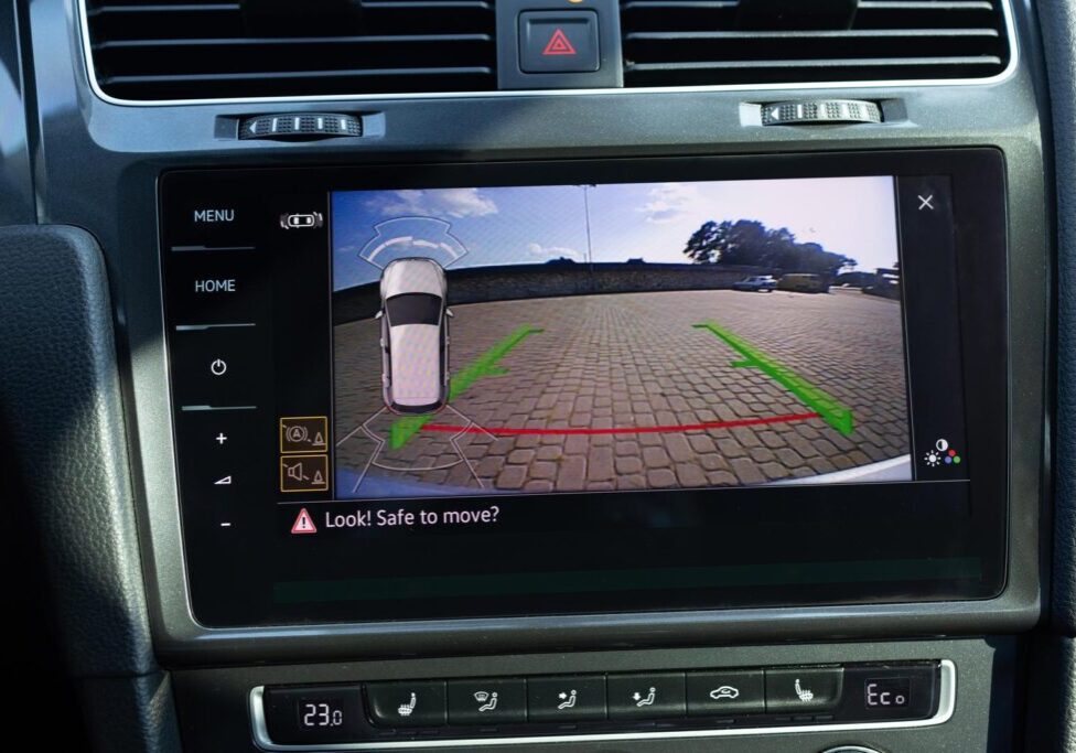 Rear View Monitor for car reverse system. Car display and rear view camera. Parking assistant inside car. Video parking system in modern car. Automotive safety technology equipment